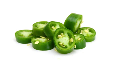 Fresh green cut chili pepper pieces on a white background 