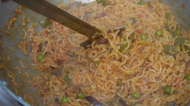 Boil water, add Maggi noodles and seasoning, cook for 2 minutes, stir well, and enjoy a quick, tasty meal.
