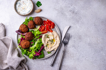 Salad with hummus, falafel and vegetables
