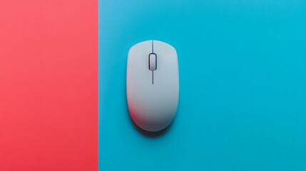 A minimalistic image featuring a computer mouse on a vibrant blue backdrop, contrasted by a bold red vertical stripe.  