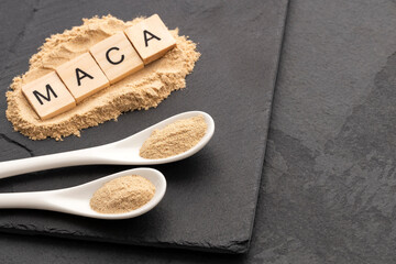 Organic ground maca in two spoons - Lepidium meyenii.