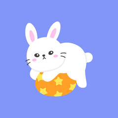 Playful White Bunny Lying on a Yellow Easter Egg with Stars