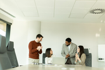 Team collaboration in a modern office setting creates innovative solutions and ideas