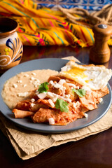 Homemade Mexican Chilaquiles with Fried Egg and Refried Beans