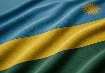 Waving Rwanda Flag Close-up of Rwandan National Symbol, Blue, Yellow, Green, and Sun, Fabric Texture.