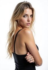 Fototapeta premium A woman in a black dress posing for a picture