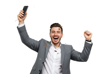 Naklejka premium Man in suit celebrating with phone in hand and confetti falling around him on a black background on transparent background