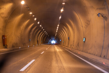 Riding in the tunnel. Driving by car through mountain tunnels
