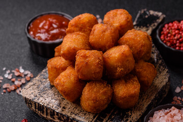 Cheese or potato croquettes, balls fried in breading with salt, spices