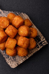 Cheese or potato croquettes, balls fried in breading with salt, spices