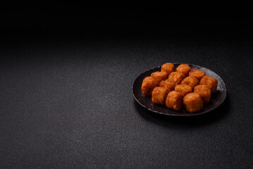 Cheese or potato croquettes, balls fried in breading with salt, spices