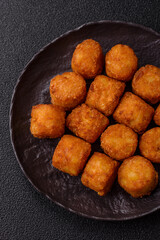 Cheese or potato croquettes, balls fried in breading with salt, spices