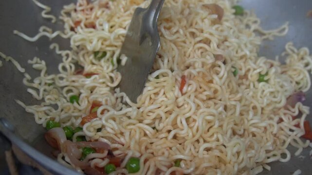 Boil water, add Maggi noodles and seasoning, cook for 2 minutes, stir well, and enjoy a quick, tasty meal.