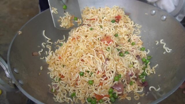 Boil water, add Maggi noodles and seasoning, cook for 2 minutes, stir well, and enjoy a quick, tasty meal.