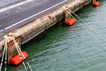 Le Havre, France-April 3, 2024, Ship Mooring Ropes And Red Fenders