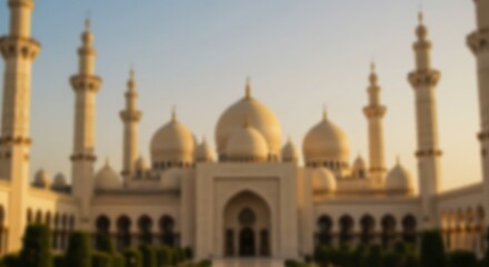 A serene golden-hour view of a majestic mosque, radiating peace and tranquility with soft, blurred details.