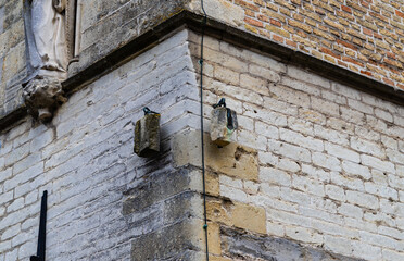 Damme, Westflandern, Belgium - April 2, 2024, Justice Stones Hanging on Town Hall