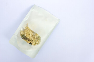 Chrysanthemum dried flower for tea in transparent white plastic packaging, ready for you to consume or sell.