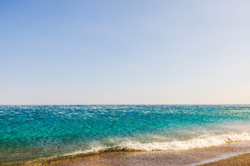 Offshore wind pushes sea waves away from shore on Aegean Sea coast of Crete island.