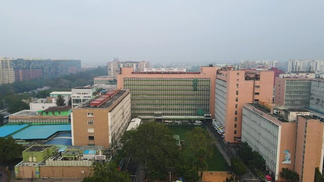 Aerial drone shot displaying a top-down view of AIIMS, highlighting its extensive medical facilities and interconnected structures.