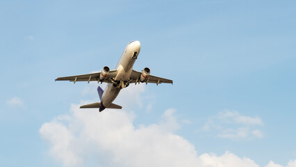 Passenger plane in the sky on takeoff