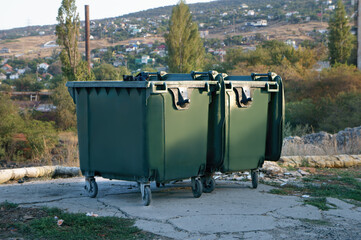 Waste Containers Positioned Against an Urban Landscape