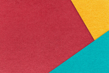 Texture craft red paper background with yellow and turquoise border. Vintage abstract wine cardboard.