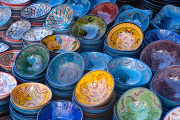 Moroccan ceramic plates, traditional pottery and market culture, local shop in Marrakech’s...