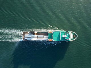 Aerial top view container ship full load container for logistics import export, shipping or transportation concept background.