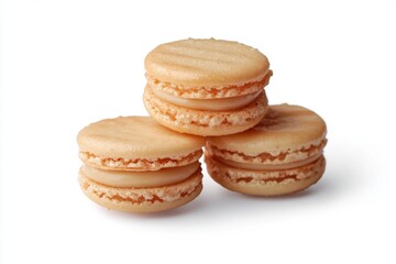 Three light beige macarons stacked, showcasing a smooth, caramel-colored filling.  Delicate, small cookies with a delicate texture, perfect for an afternoon treat