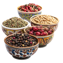 Exotic spices in ornate bowls isolated on white background