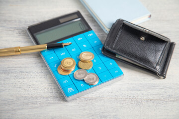 Wallet with a coins on the table. Finance