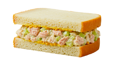 A close up shot of a tuna salad sandwich on white bread with mustard on a black background view