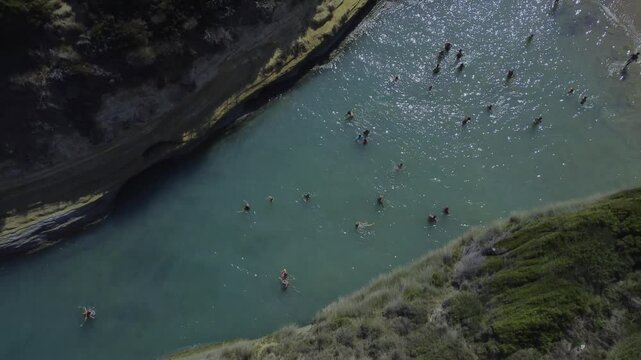 Gorgeous Aerial Drone Shot of a Turquoise Sidari Greece beach with blue green sea and rocks 