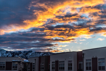 Avon, Colorado small town village modern apartment condo architecture by Vail in winter snow weather vibrant sunset view of Rocky Mountains