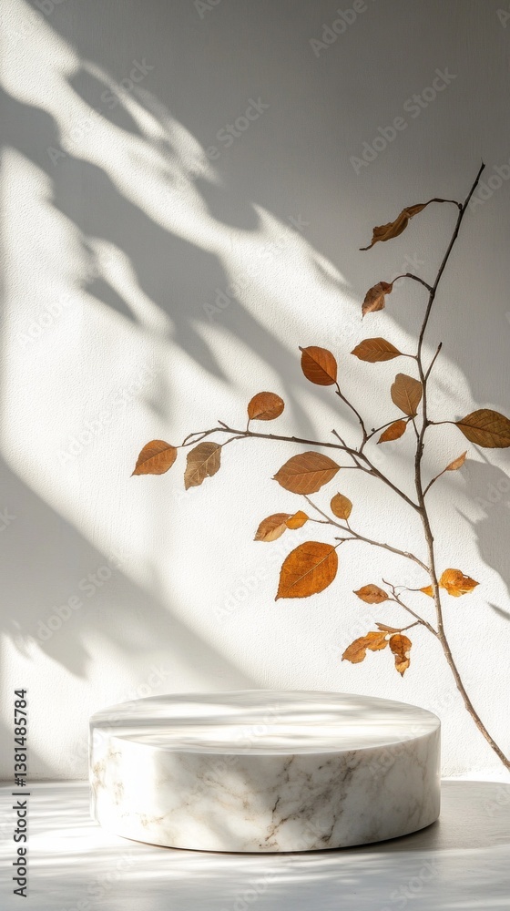 Poster a delicate branch adorned with warm autumn leaves leans gracefully against a soft wall, creating enc