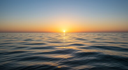 Obraz premium Serene Ocean Sunset - Peaceful ocean scene at sunset, calm water reflecting golden light. Tranquil and idyllic