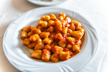 Sardinian traditional restaurant pasta in Sardinia, Italy of Ungra macaroni homemade potato gnocchi...