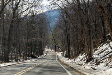 Snow capped blue ridge mountain peaks in Wintergreen ski resort Virginia area in winter with beautiful landscape view of road car point of view