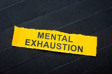 Dark strips with paper and one labeled mental exhaustion. Psychological stress.