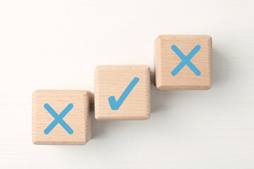 Approve of reject. Wooden cubes with check and cross marks on white background, top view