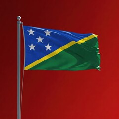 Fototapeta premium national flag of solomon islands waving on the wind, banner on redscreen red solid color background, flagpole with simbol of the country waves on windy day