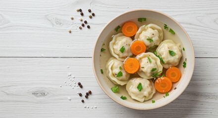 Delicious dumplings served in clear broth with vibrant carrot slices and fresh herbs creating an inviting and comforting meal presentation on a rustic wooden table