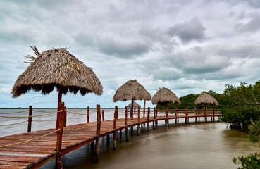 Fototapeta premium Floating Paradise: Palapas and Walkways Over the Water of Rio Lagartos