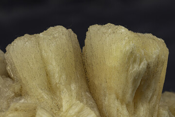 Striking yellow crystal formation, featuring sharp, defined ridges perfect for collectors, educational purposes, or as a distinctive decor element