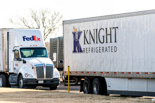 Ellsworth, USA - November 22, 2022: Kansas interstate i70 road cars and trucks with sign for Knight refrigerated, FedEx freight in westbound rest area