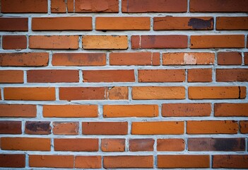 Obraz premium A red brick wall with a blue background.