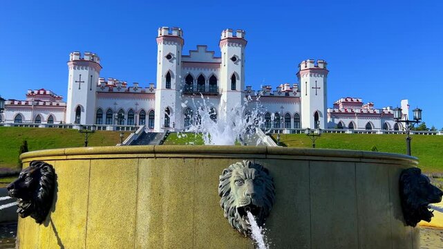 Belarus, Puslovsky Palace, September 5, 2024: Kossovsky Autumn Castle. An old historical castle in Kosovki in sunny autumn weather. An architectural monument in the style of English Neo-Gothic. 4K