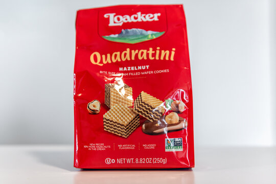 Destin, USA - March 6, 2023: Quadratini brand wafers dessert with hazelnut filling flavor variety closeup macro of Italian imported product