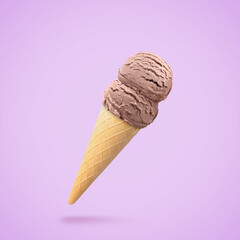 Yummy ice cream served in waffle cone in air on violet background